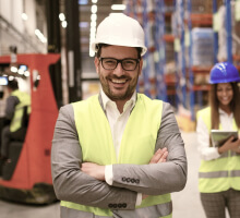 Man standing in a marble factory, representing craftsmanship and quality at United Marble Factory